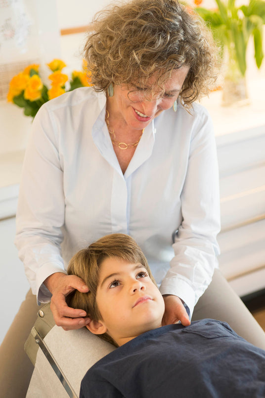 Dr. Charny Chiropractor adjusting a patient