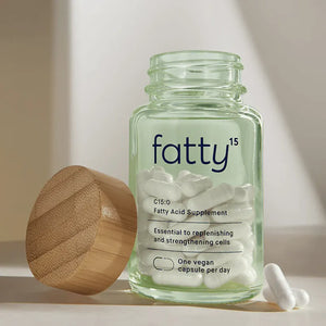 Fatty15 by Fatty15 Bottle with Capsules and bottle top leaning against bottle